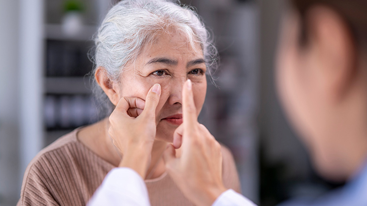 A doctor assessing a woman's suitability for laser cataract surgery