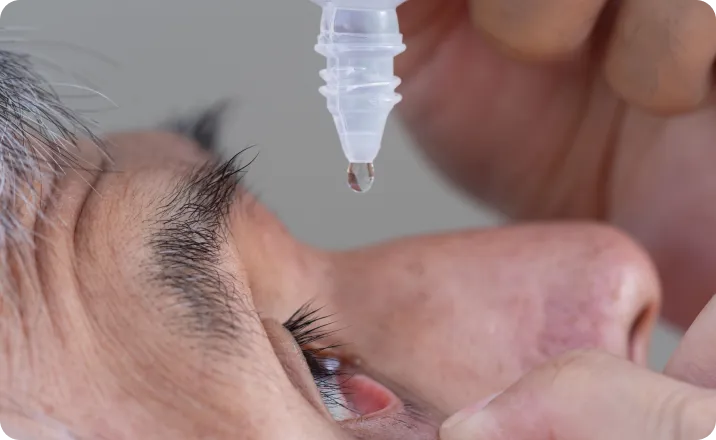 eyesdrops on old asian male